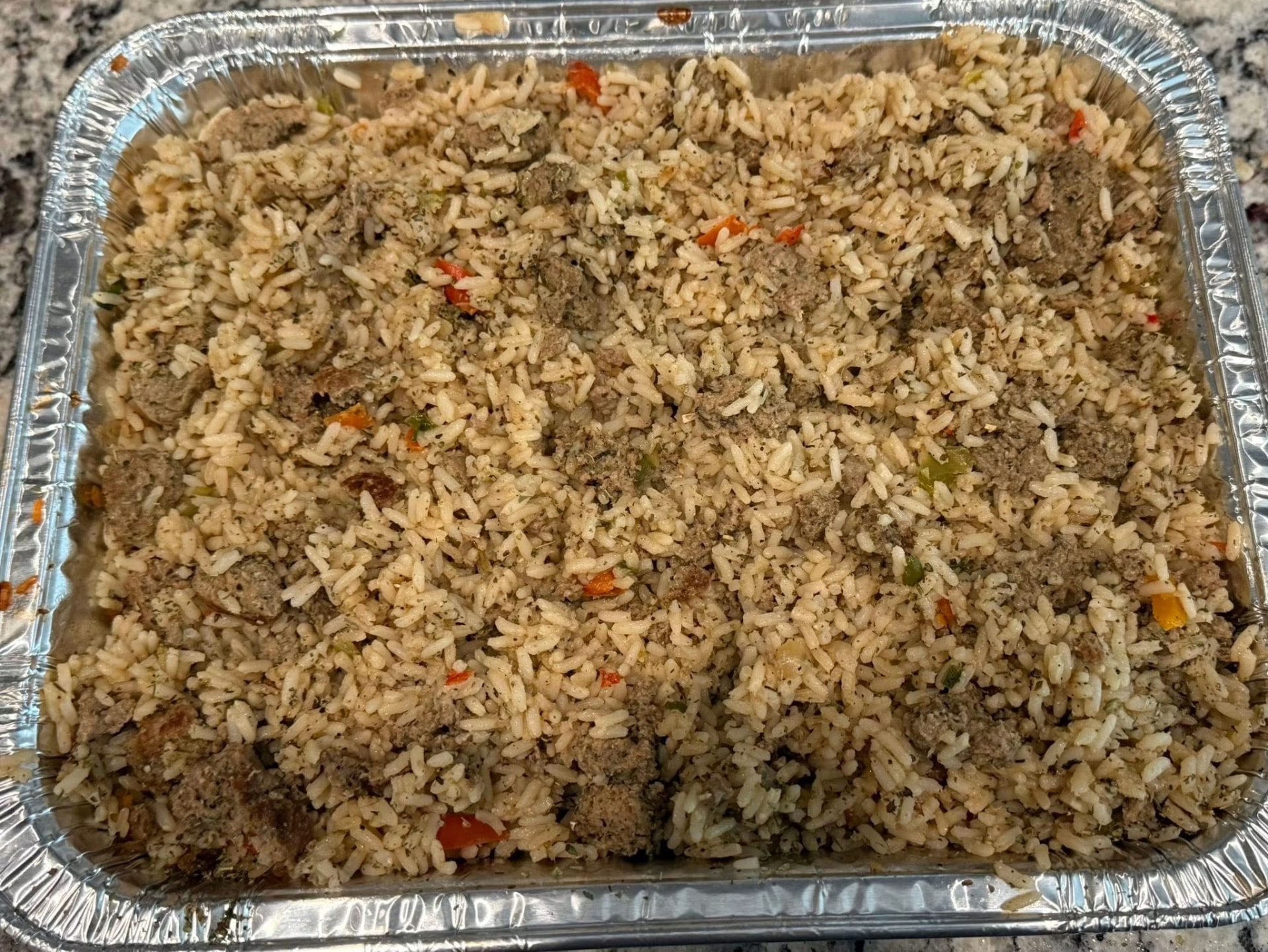 Catering pan of seasoned dirty rice